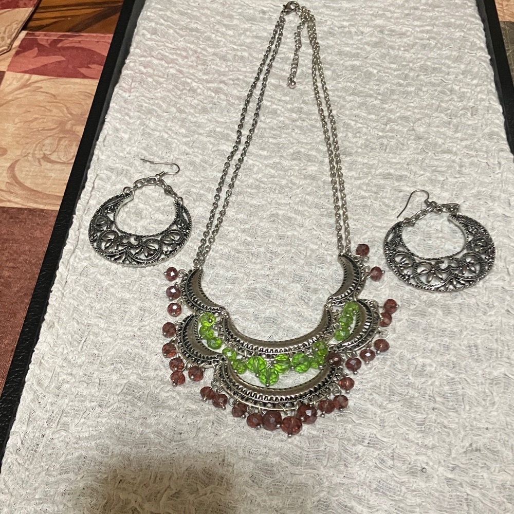 Silver tone filigree necklace, green and purple beads and earrings